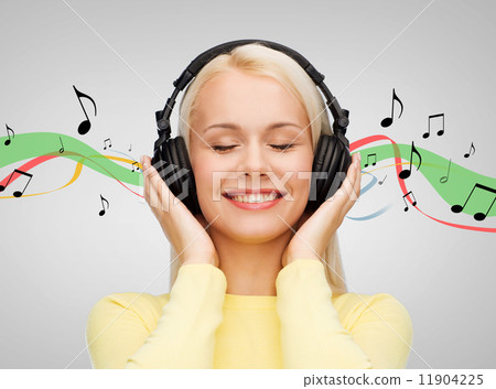 smiling young woman with headphones smiling young woman with headphones 11904225