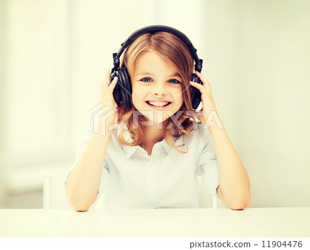 little girl with headphones at home little girl with headphones at home 11904476