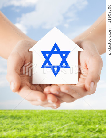 close up of hands holding house with star of david close up of hands holding house with star of david 11905100