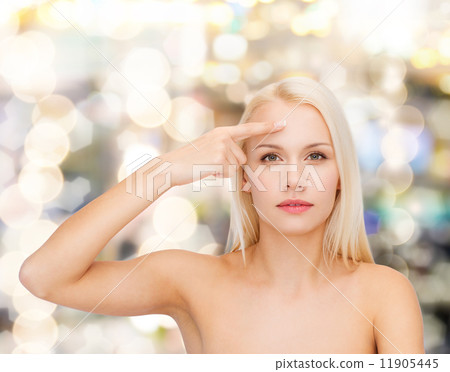 beautiful woman touching her forehead beautiful woman touching her forehead 11905445