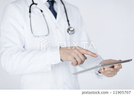 male doctor holding tablet pc 11905707