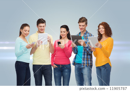 group of teenagers with smartphones and tablet pc 11905787