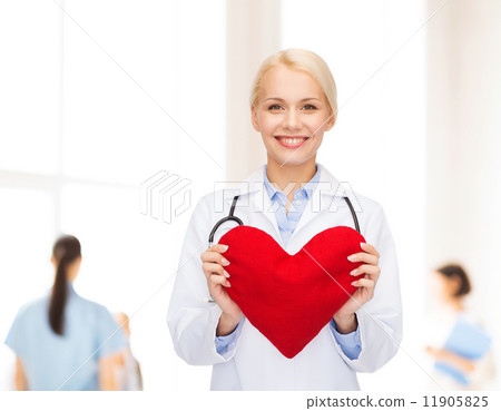 smiling female doctor with heart and stethoscope 11905825