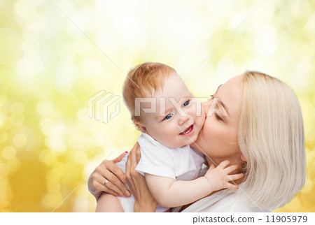 happy mother kissing smiling baby happy mother kissing smiling baby 11905979