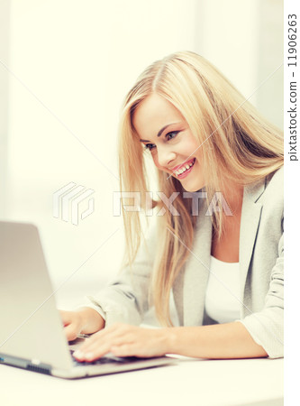 businesswoman with laptop 11906263