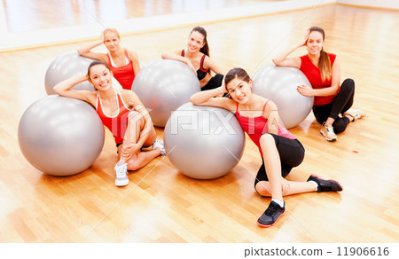 smiling people working out in pilates class 11906616