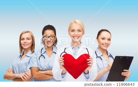 smiling female doctor and nurses with red heart smiling female doctor and nurses with red heart 11906643