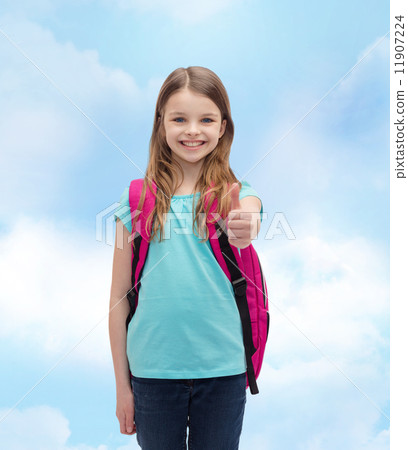 smiling girl with school bag showing thumbs up smiling girl with school bag showing thumbs up 11907224