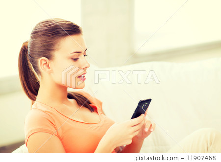 woman with smartphone at home 11907468