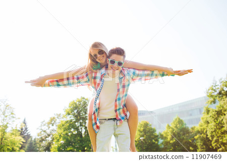 smiling couple having fun in park smiling couple having fun in park 11907469