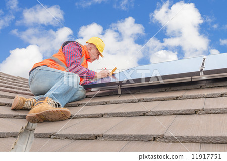 worker and solar panels 11917751