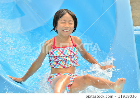 Girls playing on the pool slide Girls playing on the pool slide 11919036