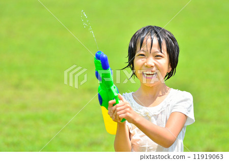 Girl playing with water gun (lawn open space) Girl playing with water gun (lawn open space) 11919063
