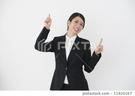 A young woman pointing up A young woman pointing up 11920167