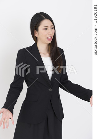 An angry-looking young lady 11920191