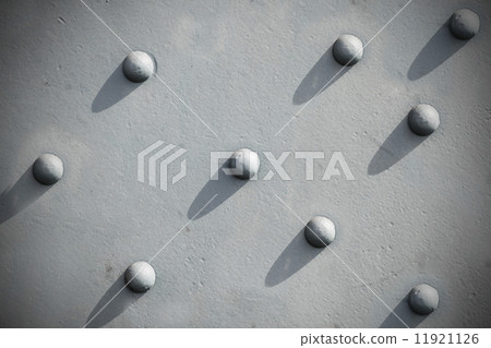 Abstract gray background, riveted metal textured. 11921126