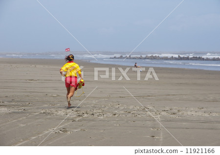 Life saver running towards the sea 11921166