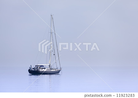 Lonely yacht in calm blue sea Lonely yacht in calm blue sea 11923283