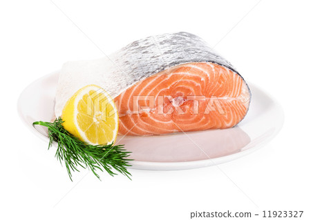 Raw steak of salmon on white plate isolated 11923327
