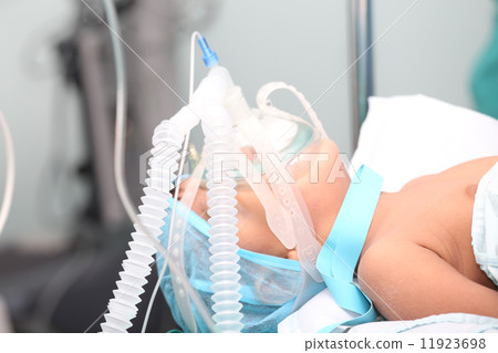 Unidentified boy with oxygen mask in the surgery. Focus in the m Unidentified boy with oxygen mask in the surgery. Focus in the m 11923698