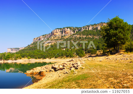 Rocky landscape with mountains reservoir Rocky landscape with mountains reservoir 11927055