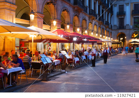 Street restaurants at Placa Reial in  night. Barcelona 11927421