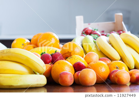 various fresh fruits at table 11927449