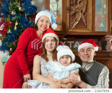 happy family in christmas hats happy family in christmas hats 11927656