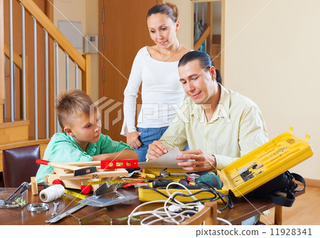 Ordinary family with working tools Ordinary family with working tools 11928341