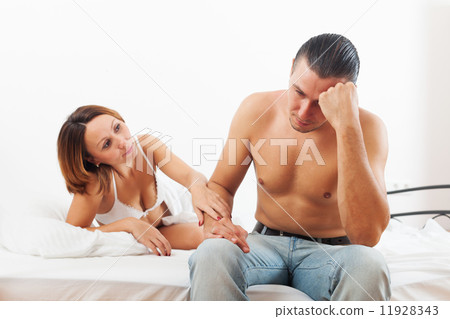 Man has sad, woman consoling him Man has sad, woman consoling him 11928343