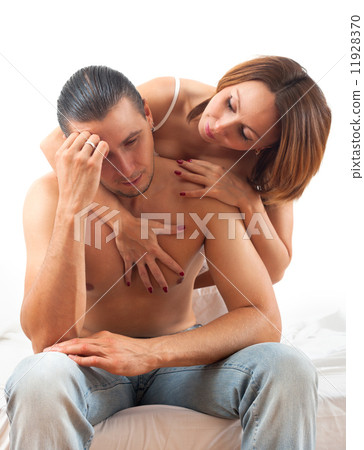 Woman consoling the depressed husband in bed 11928370