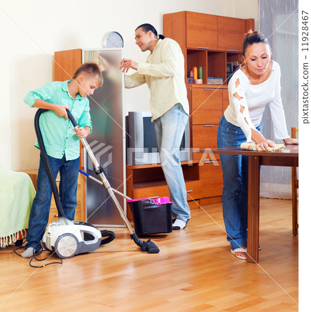 Parents and boy cleaning in room Parents and boy cleaning in room 11928467