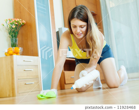 young housewife caring for parquet young housewife caring for parquet 11928468