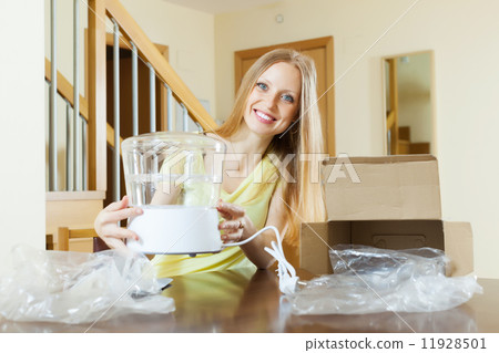 young housewife with steamer in home young housewife with steamer in home 11928501