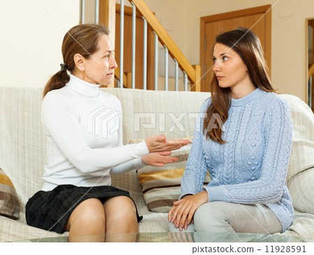 daughter and mother having serious talking daughter and mother having serious talking 11928591