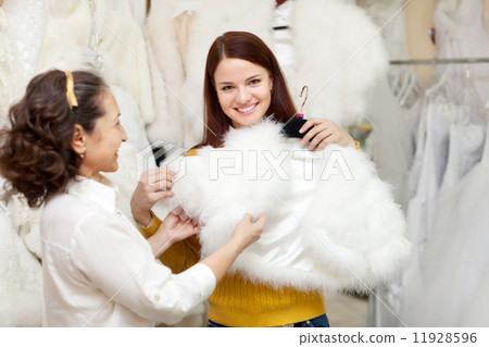 happy women chooses bridal outfit at wedding store happy women chooses bridal outfit at wedding store 11928596