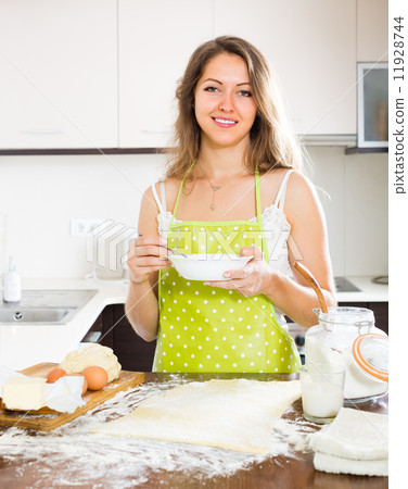 Housewife cooking at home kitchen Housewife cooking at home kitchen 11928744