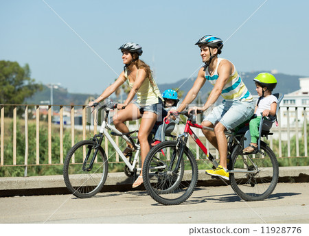 Family of four traveling by bicycles Family of four traveling by bicycles 11928776