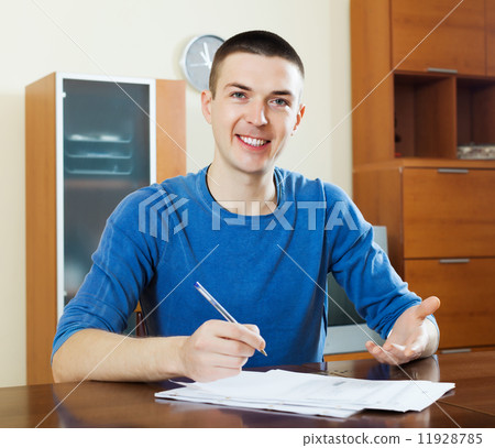 Happy man with documents 11928785