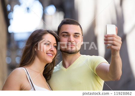 Couple doing selfie at the street 11928862