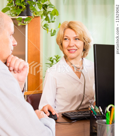 Elderly man with doctor in clinic Elderly man with doctor in clinic 11929062