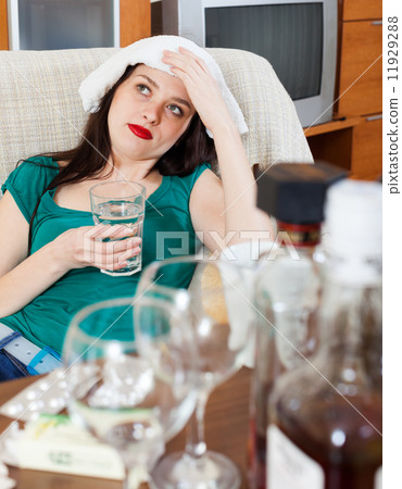 Suffering girl having hangover Suffering girl having hangover 11929288