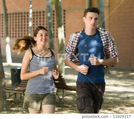 Smiling young people running outdoor Smiling young people running outdoor 11929317