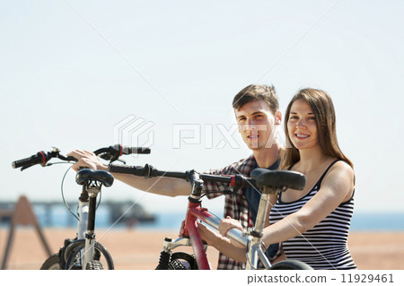Couple having rest after cycling Couple having rest after cycling 11929461