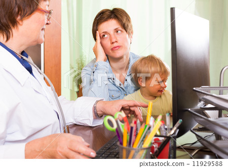 Doctor examining baby Doctor examining baby 11929588