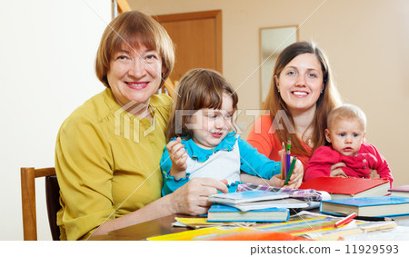 senior woman with daughter and grandchildren at home. 11929593