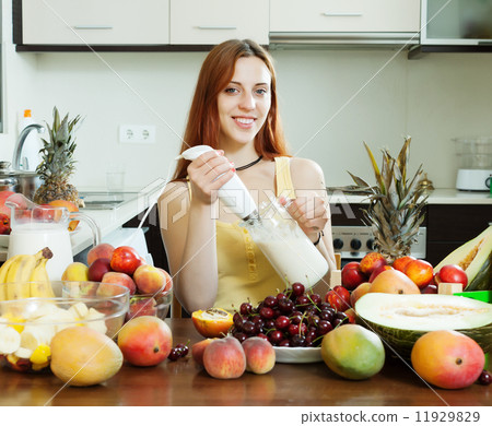 woman making fresh milk cocktail 11929829