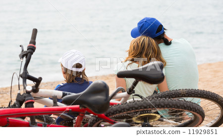 Parents and son with bicycles 11929851