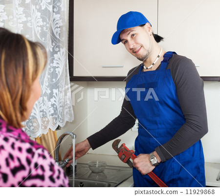 man in uniform repairing a running water 11929868