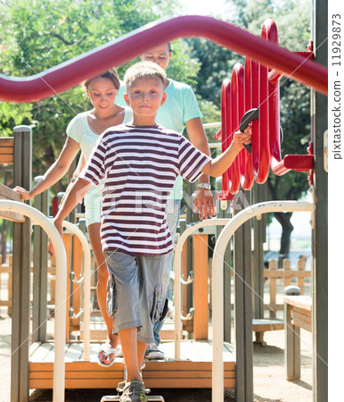 family of three overcomes obstacle course 11929873